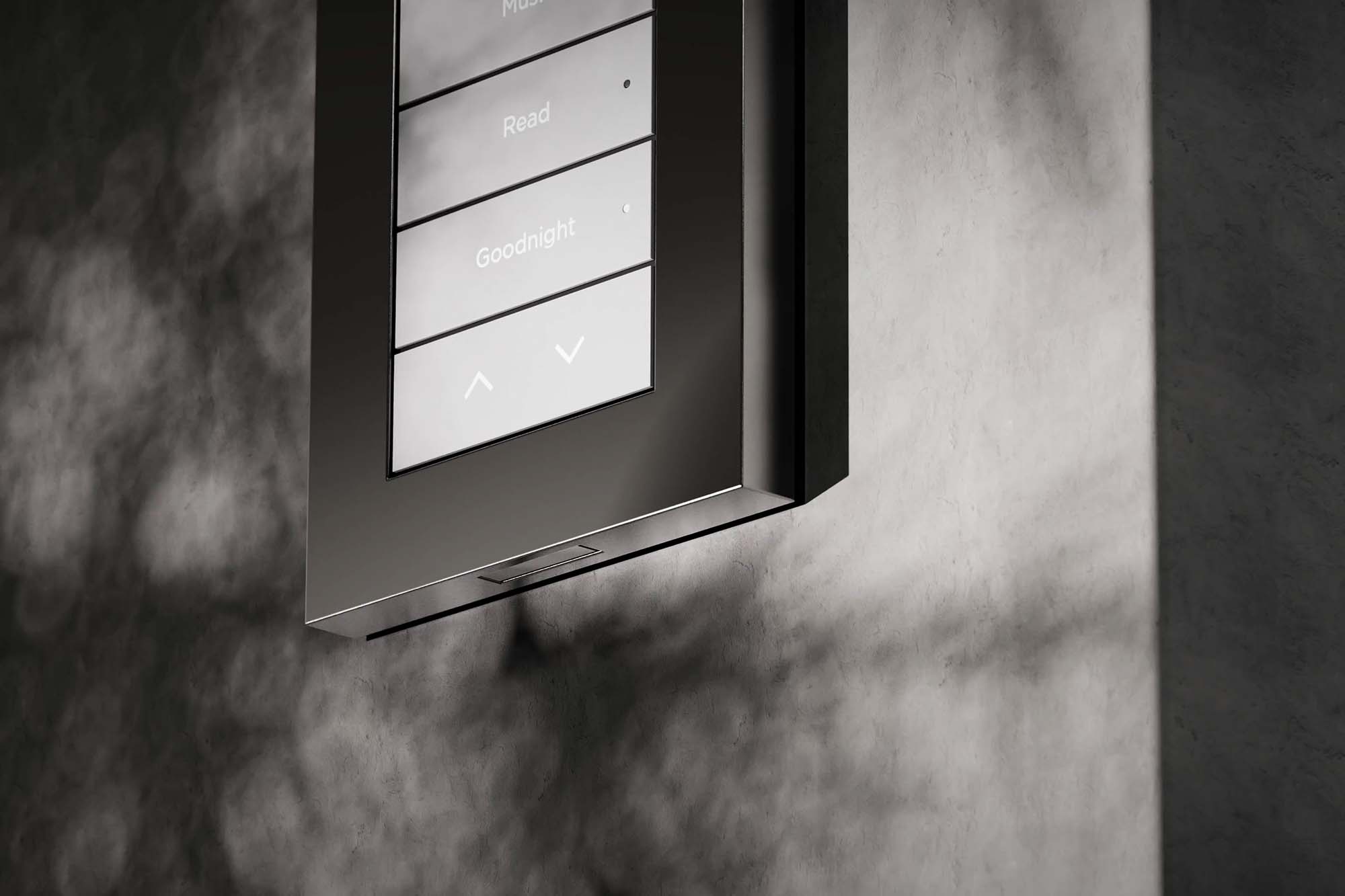 Control4 touch panel on wall above light switches