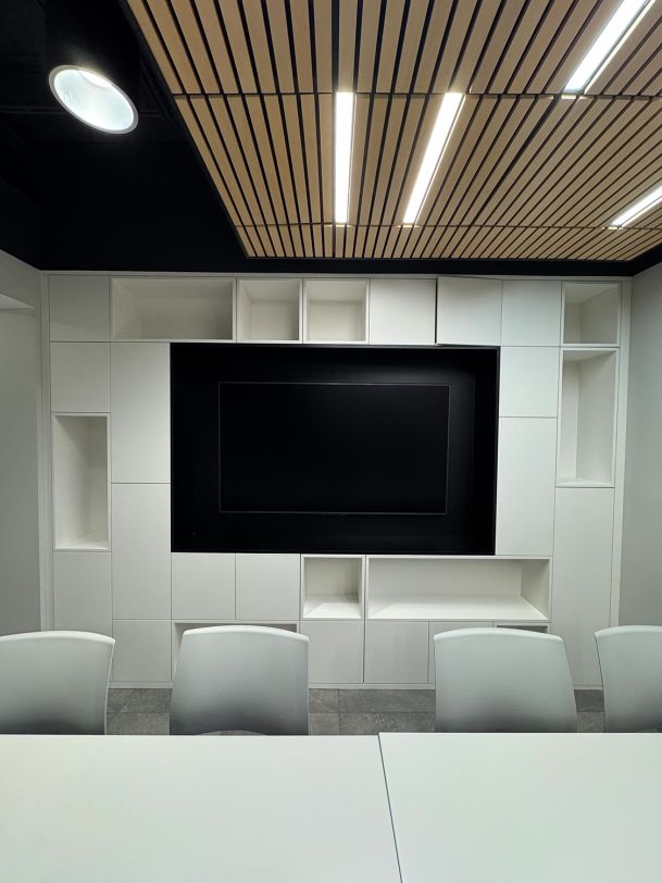 Vertical detail of corporate media wall panel enclosing large blank video display screen